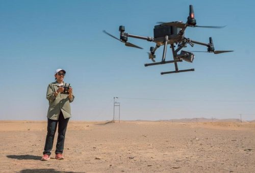 Female Trainee learning to fly the Matrice 350RTK in the desert